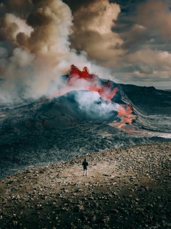 a large, plumed volcano spewing lava and ash into the air