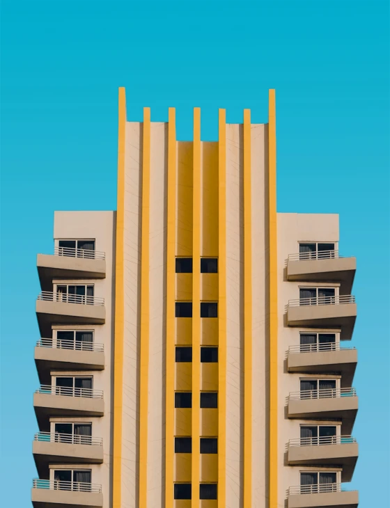 the top of a building in front of a blue sky