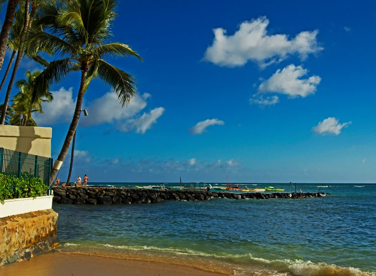 the water and beach is calm on a beautiful day