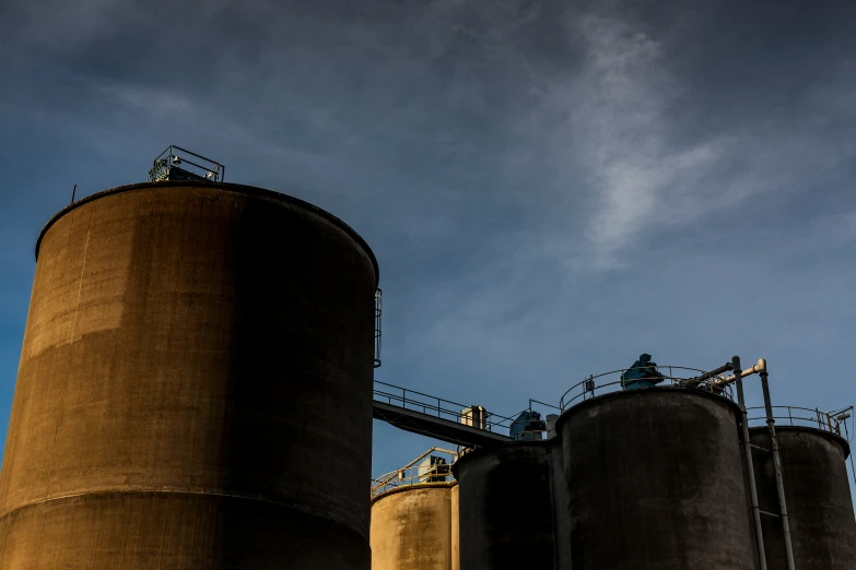 two large silos next to one another