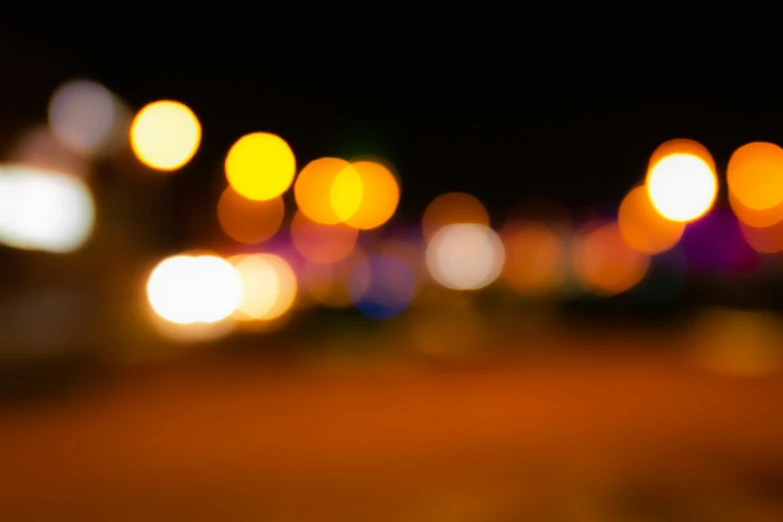 an blurry background with blurred lights, with yellow and purple lights