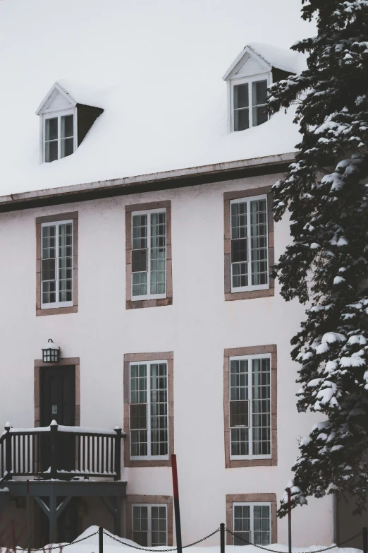 a large white building with lots of snow on top