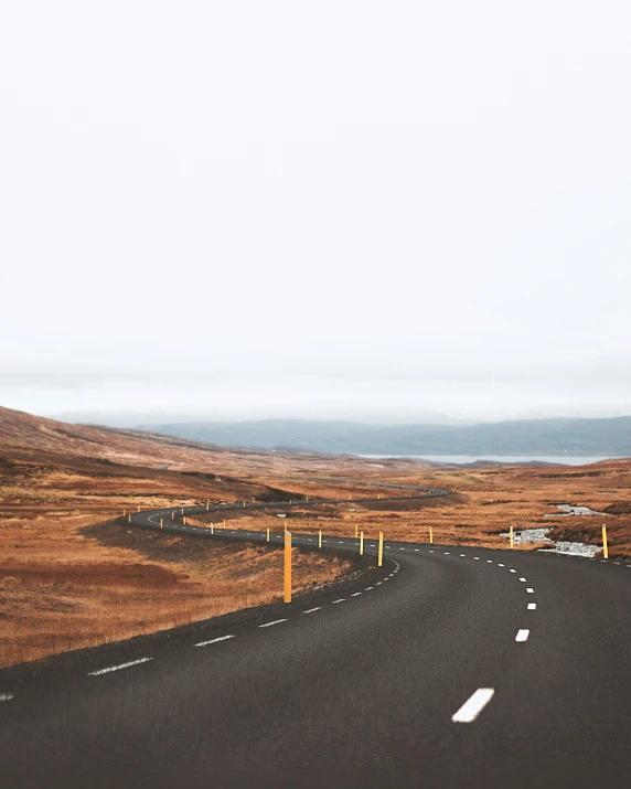 the road is empty in the middle of the prairie