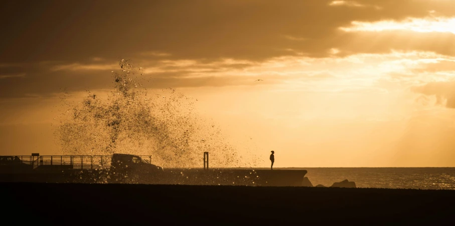 a boat with spray of water in the background