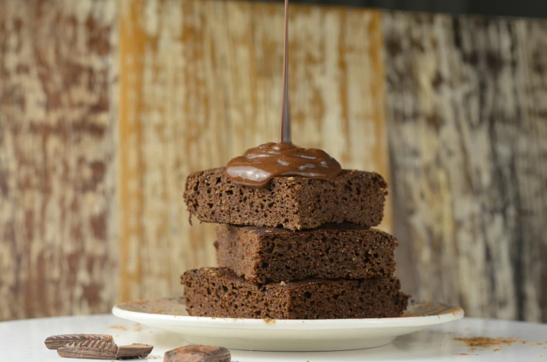 some brownies sitting on top of a plate on a table