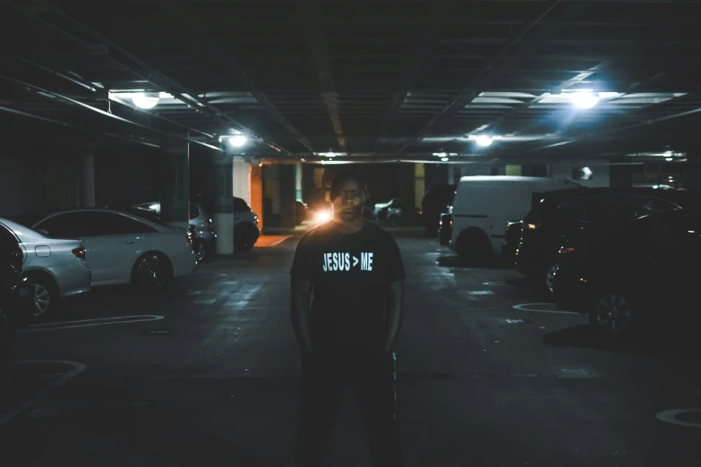 a parking garage that has two person standing in the middle of it