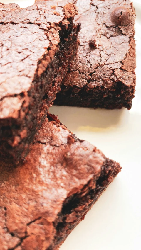 a close - up view of one of two pieces of brownie