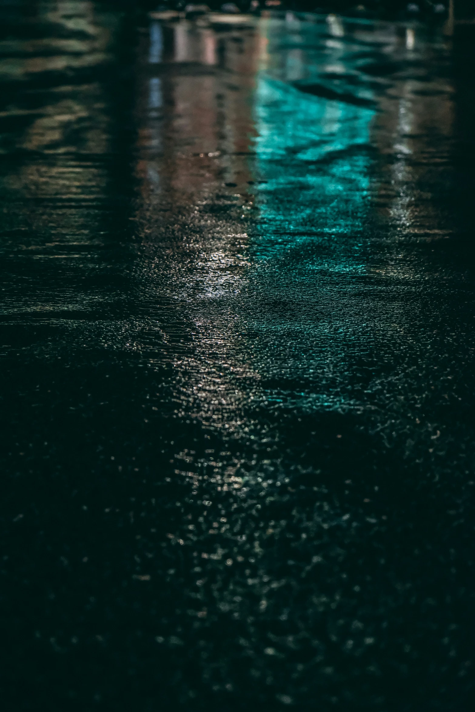 this po shows the side of a building and lights reflecting off the water