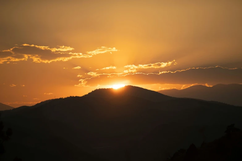 a large mountain with a sky background