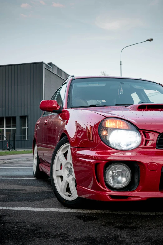 the front end of a red honda civic