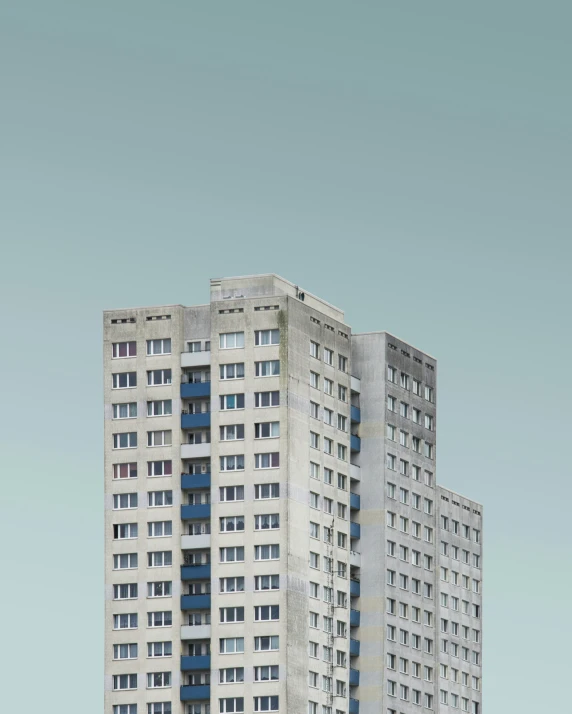 a tall building with several windows near the top