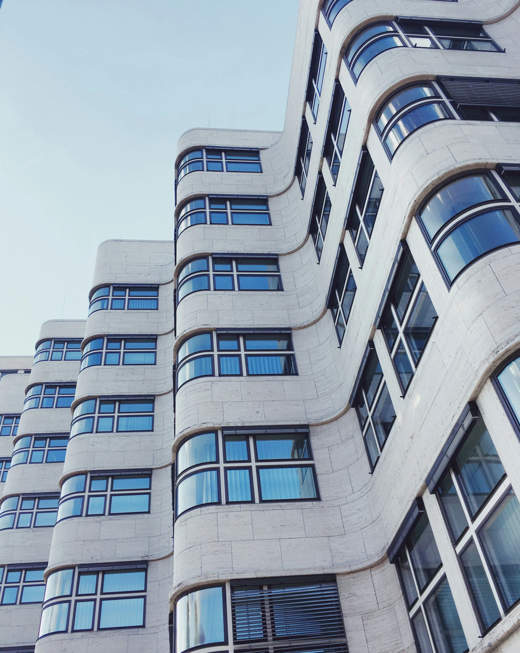 a large building with very tall windows and lots of windows on it