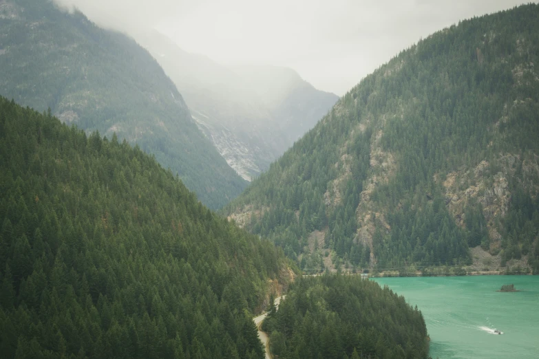 a scenic view of some mountains and a body of water