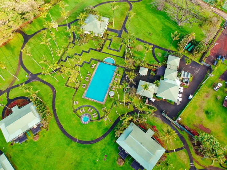 an aerial view of houses with a pool