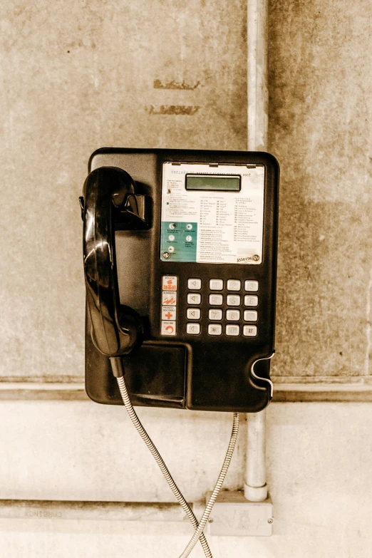 a phone is seen sitting on the wall