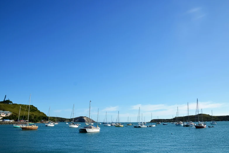 an image of a harbor filled with boats on the water