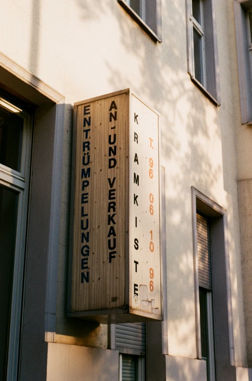an outside view of a building with several signs mounted on the side