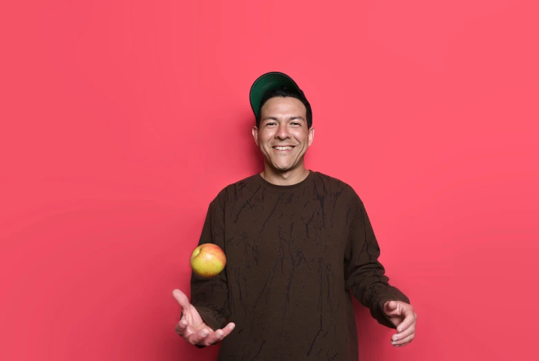 a person with an apple in their hand