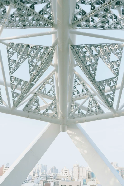 the underside of a structure with many white metal structures