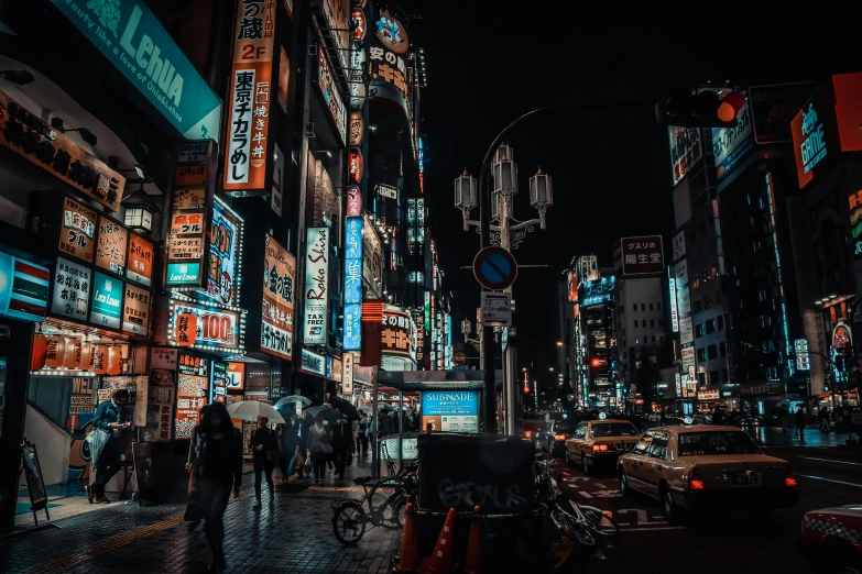 an image of people walking down the street at night