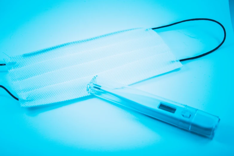 a medical mask laying on a table top