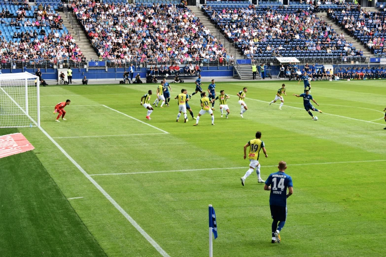 soccer players are playing soccer on an artificial field