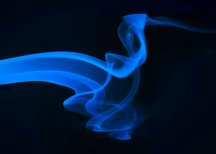 smoke swirling in the dark blue colored light