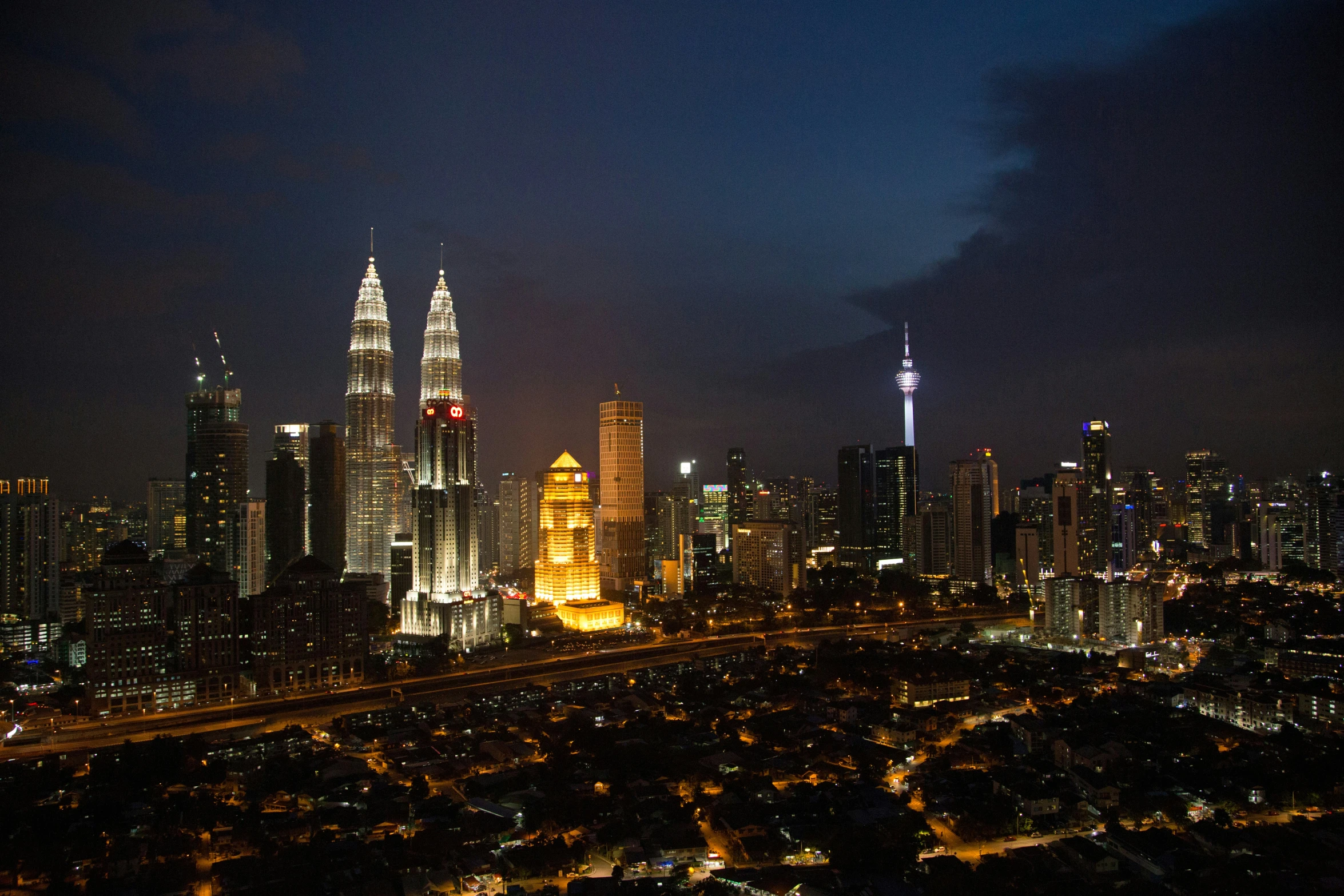 cityscape with illuminated skyscrs at night