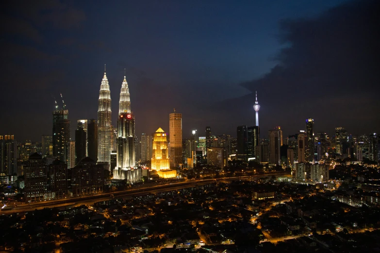 cityscape with illuminated skyscrs at night