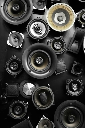 a big pile of speakers laying together on top of each other