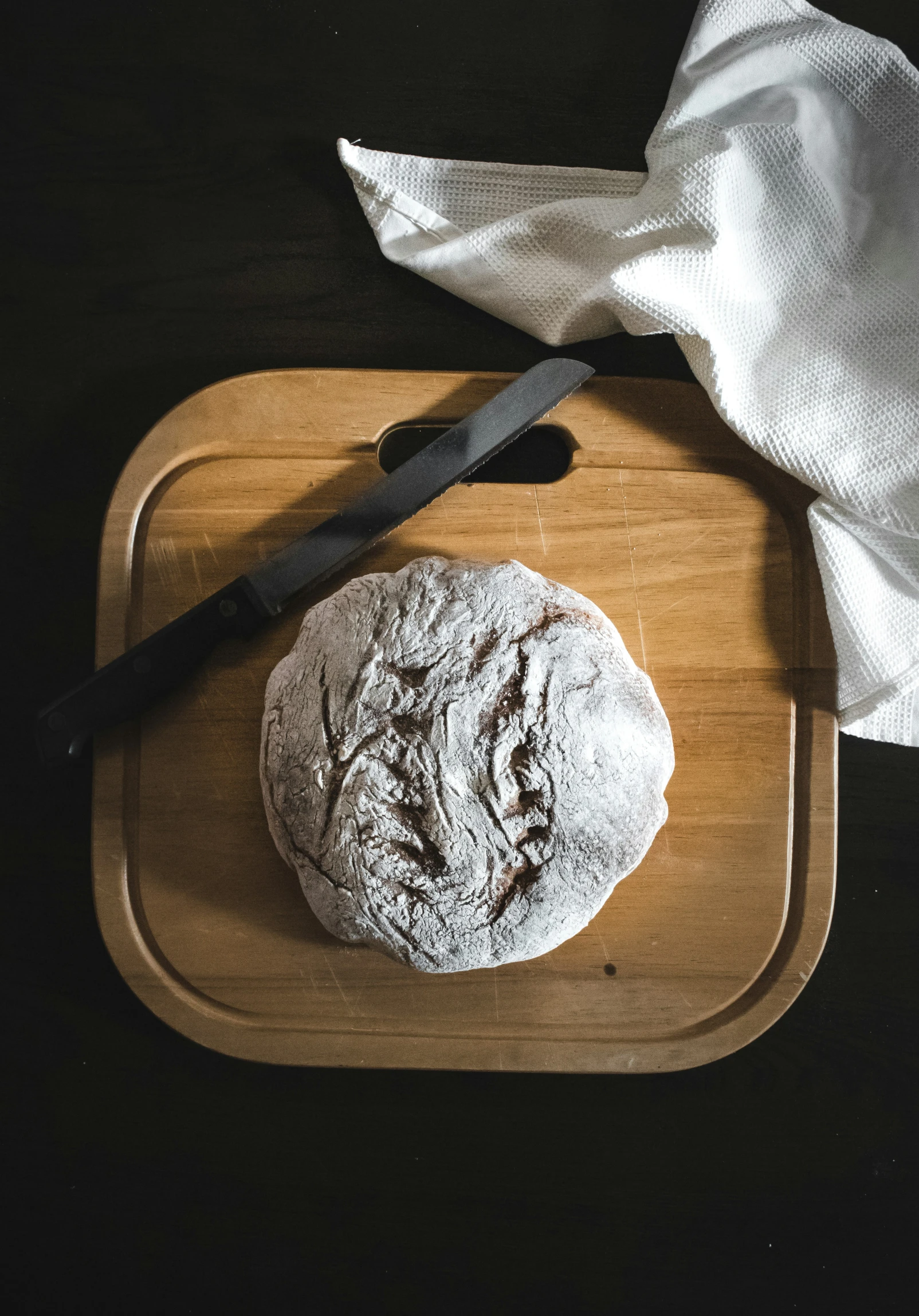 there is a large round cookie on the  board