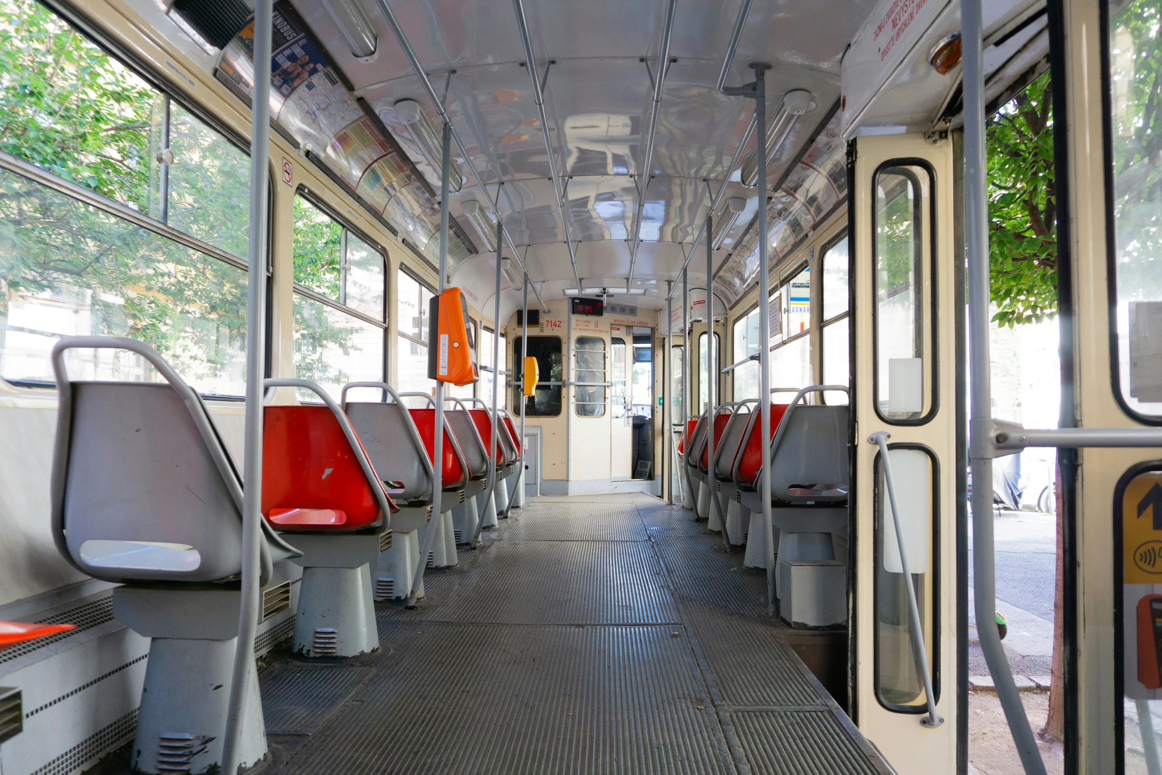 the inside of an old school bus with its red seats