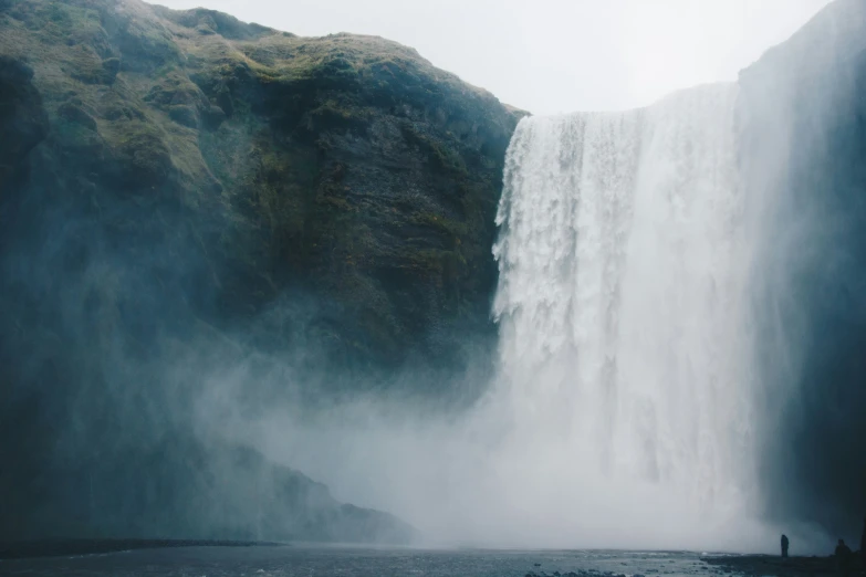 an image of a waterfall in the middle of a lake