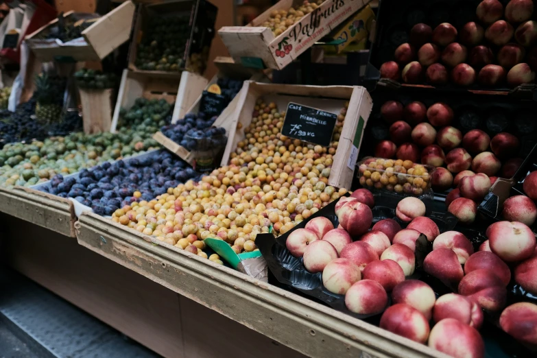 baskets of apples on display in a market