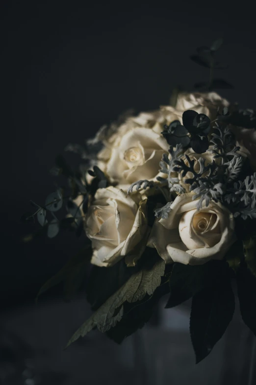 a bunch of white flowers with leaves and flowers in it