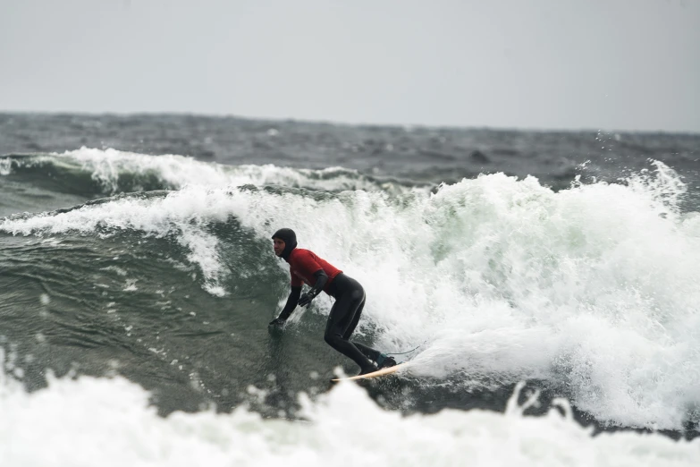 a surfer is surfing the crest of a wave