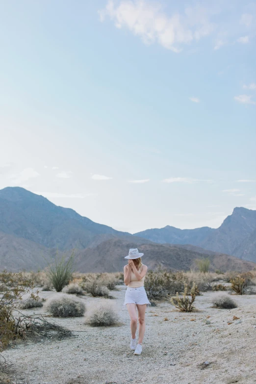 a man in white shorts and  on the desert