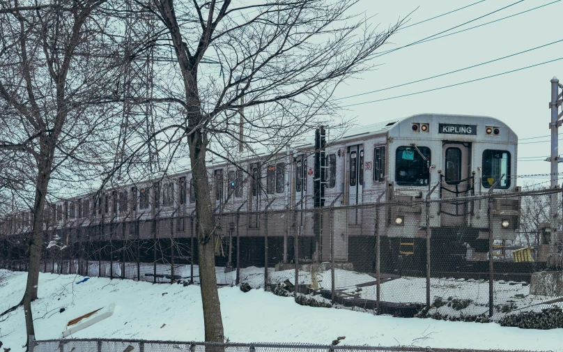 a train traveling on tracks next to trees