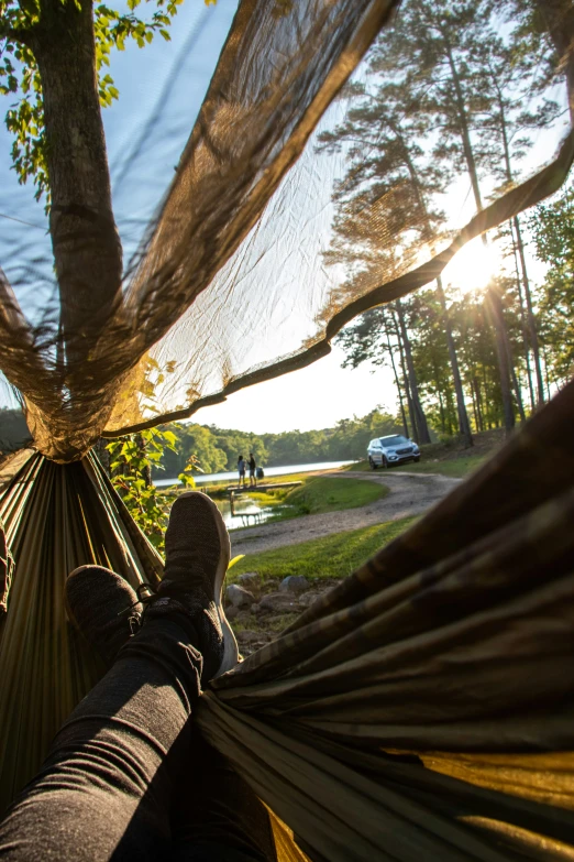 there is a person that is laying in a hammock