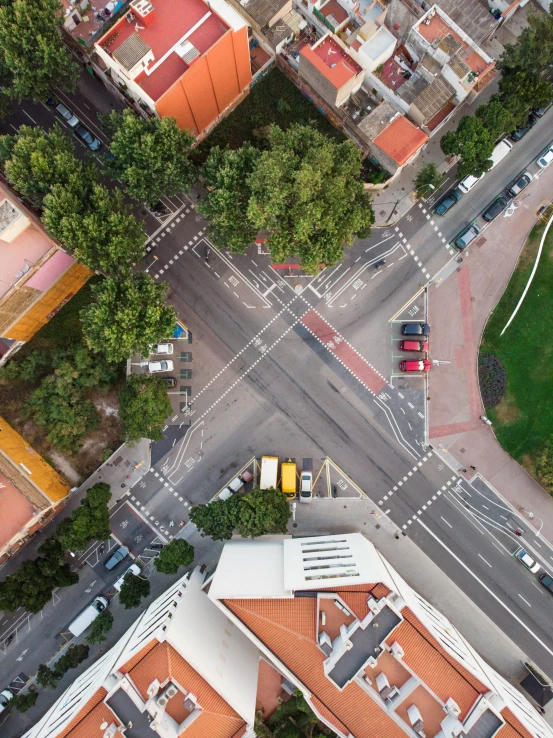 the city has orange roofs and many tall buildings