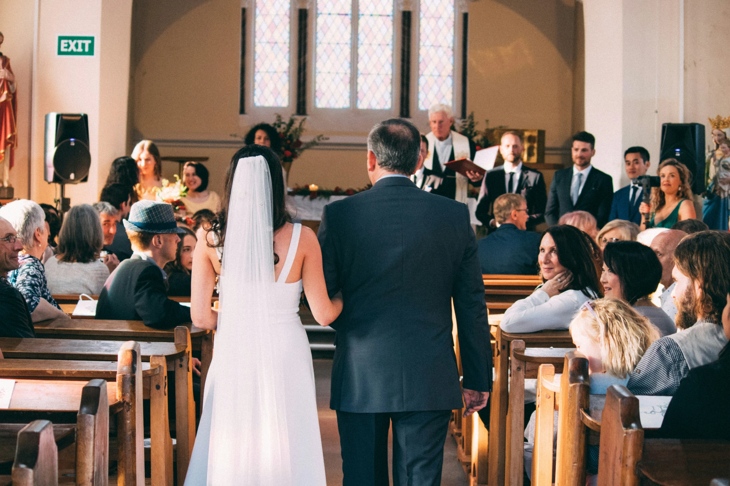 a couple walking back down the aisle at their wedding