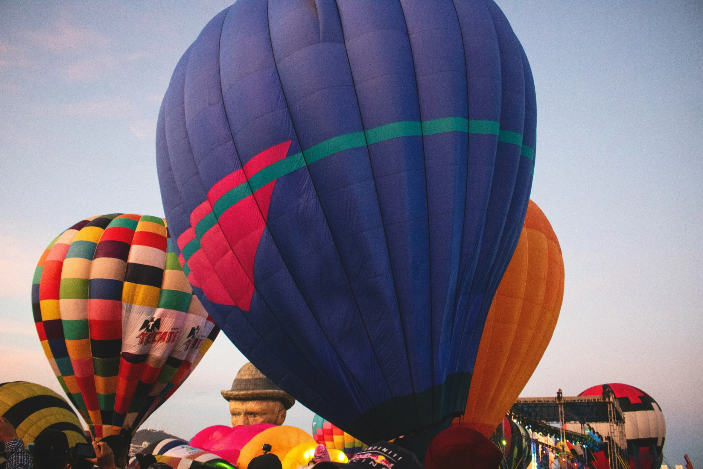 many balloons are in the air at an event