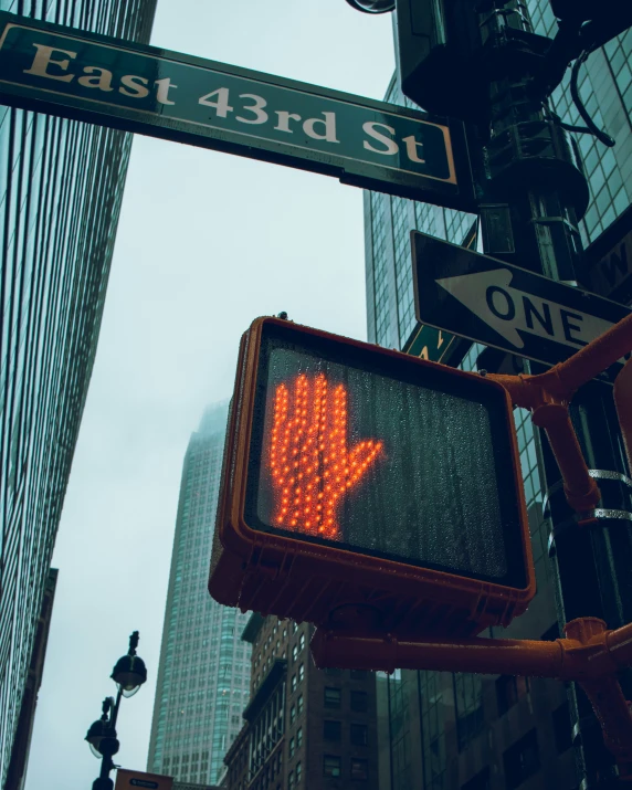 a lit up sign is in the middle of a city