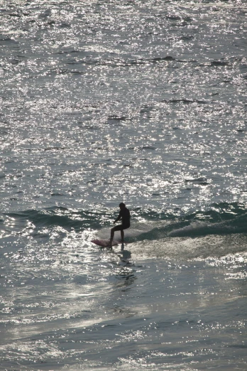a person on a surfboard rides the waves