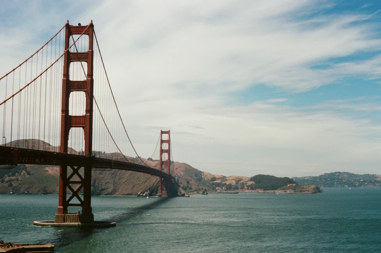 a very tall bridge spanning across the ocean