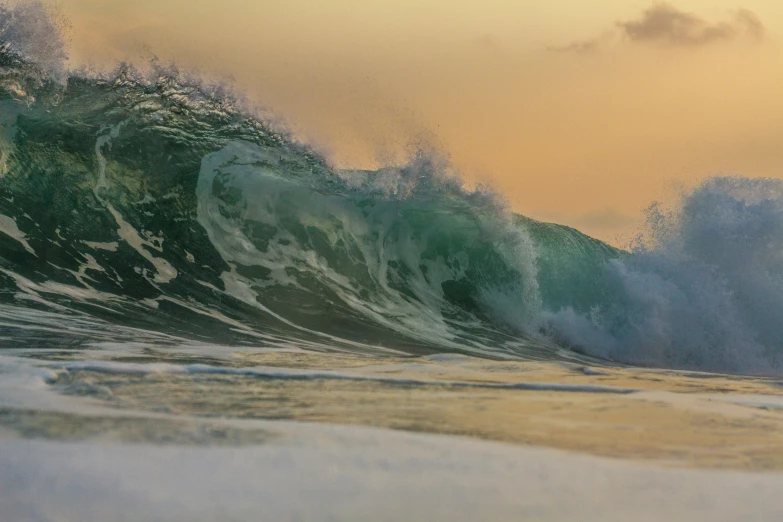 a person on a surfboard in front of waves