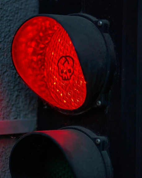 an stoplight with the red light flashing on