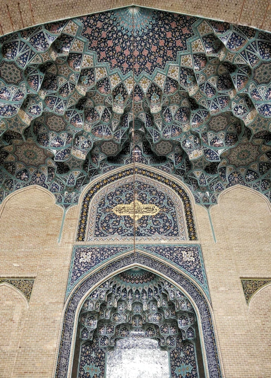 an ornate entrance in an arch and wall