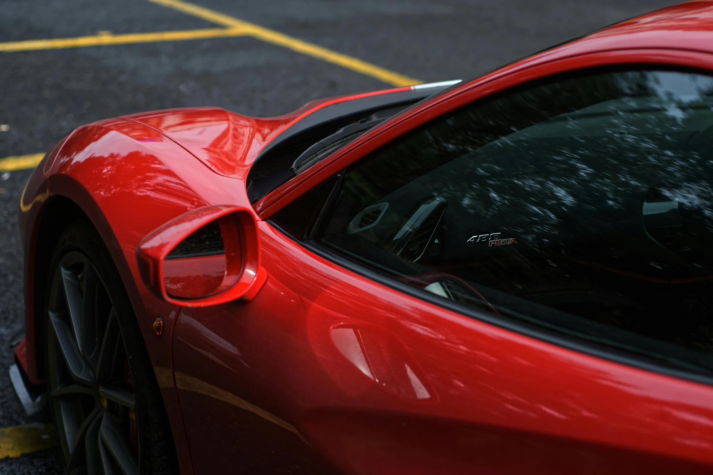 the front end of a red sports car