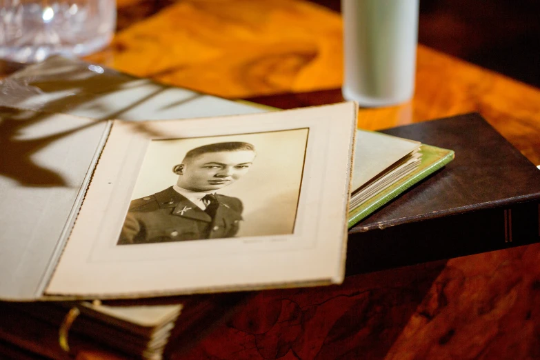 a picture of an old man is sitting on a table